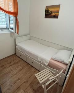 Ένα ή περισσότερα κρεβάτια σε δωμάτιο στο apartman MAMA
