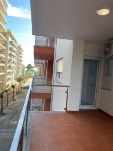 a balcony of a building with a walkway at Beach house in Shëngjin