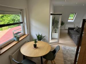 a living room with a table and chairs and a couch at Casa Pedro in Osnabrück