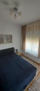 Ένα ή περισσότερα κρεβάτια σε δωμάτιο στο Elegance