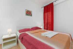 Postel nebo postele na pokoji v ubytování Sita Apartmani