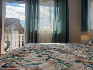 Postel nebo postele na pokoji v ubytování Apartments Zupan