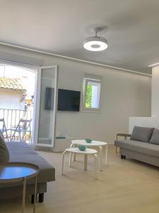 a living room with a couch and a table at CASUAL HOME VALENCIA in Valencia