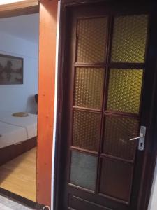 a door leading to a room with a bed at Apartament Neptun in Neptun