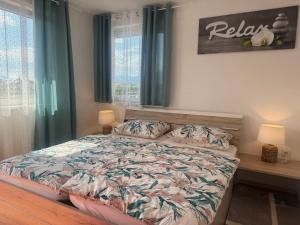 Postel nebo postele na pokoji v ubytování Apartments Zupan