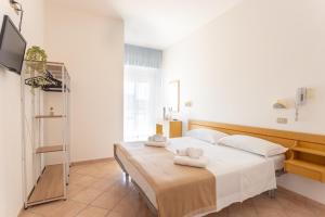 Postel nebo postele na pokoji v ubytování Hotel Katina