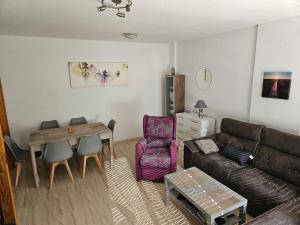 a living room with a couch and a table at Los Belones, Mar Menor España in Los Belones