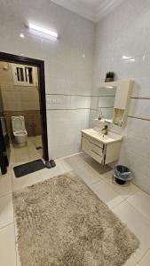 a bathroom with a sink and a toilet at شقق سكنية مفروشة بالباحة 1 in Al Jith