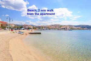 a beach min walk from the apartment at Seafront apartments Marija in Rogoznica
