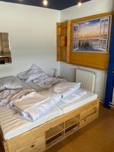 a large bed in a room with a window at Haus mit Aussicht S3-Bahn, B14-Straße, WLAN in Schwaikheim