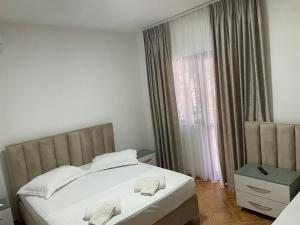Postel nebo postele na pokoji v ubytování Hotel Ani