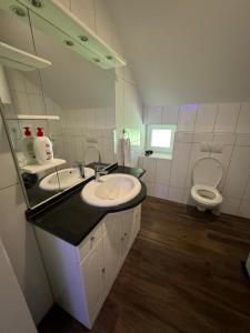 a bathroom with a sink and a toilet at Ivan in Livno +14 photos