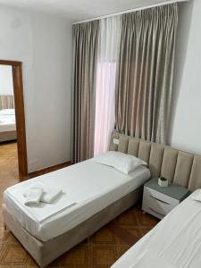 Postel nebo postele na pokoji v ubytování Hotel Ani