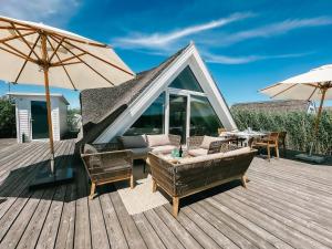 Balkón nebo terasa v ubytování Seehütte Sonnenschilf - Premium Hide-Away Ferienhaus in Rust direkt am Neusiedlersee