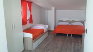 A bed or beds in a room at Casa Vacanza Miramare