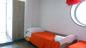 A bed or beds in a room at Casa Vacanza Miramare