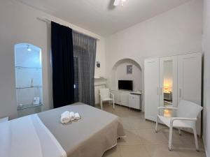 Postel nebo postele na pokoji v ubytování KiMia Home, Centro