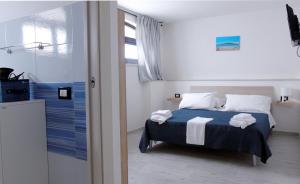 A bed or beds in a room at Casa Vacanza Miramare