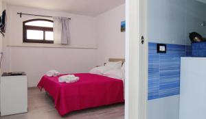 A bed or beds in a room at Casa Vacanza Miramare