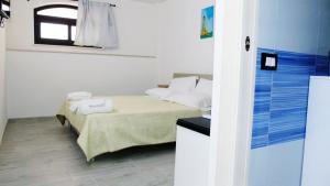 A bed or beds in a room at Casa Vacanza Miramare