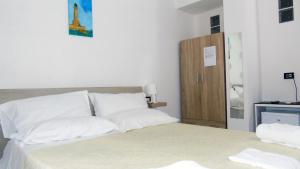 A bed or beds in a room at Casa Vacanza Miramare