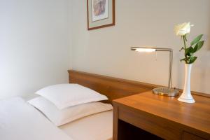 Ένα ή περισσότερα κρεβάτια σε δωμάτιο στο Hotel Laguna Zagreb