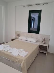 Postel nebo postele na pokoji v ubytování Villa Lemonia