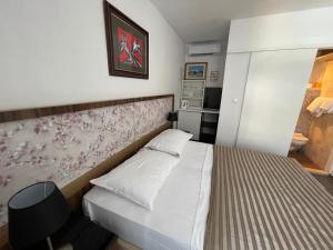 Ένα ή περισσότερα κρεβάτια σε δωμάτιο στο Rooms Tirreno