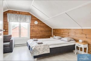 a bedroom with a large bed and a window at B&B Villa Kauppila in Ii