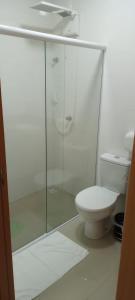 a bathroom with a glass shower and a toilet at HOTEL CALIFÓRNIA in Concordia +19 photos