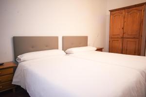 Postel nebo postele na pokoji v ubytování Apartacentro