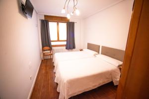 Postel nebo postele na pokoji v ubytování Apartacentro