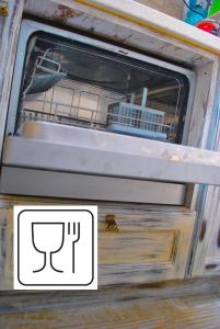 a drawer with a fork and a sign on it at Apartment Mediterraneo Blue Sky in Perast