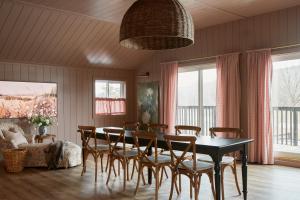 a dining room with a table and chairs at The June Motel, Beaver Valley in Kimberley