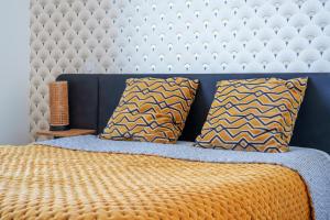 a bedroom with a bed with two pillows at Hyper centre vue bords Loire #confort #luxe in Tours