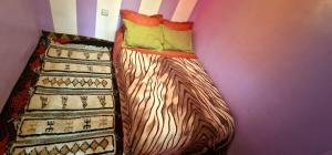 Uma cama ou camas num quarto em Gite Tamounte