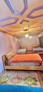 Uma cama ou camas num quarto em Gite Tamounte