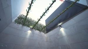 a bathroom with plants on the wall and lights at Casa Pescadores Torrevieja in Torrevieja +21 photos