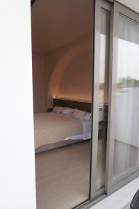 Postel nebo postele na pokoji v ubytování Ano Kampos Hotel