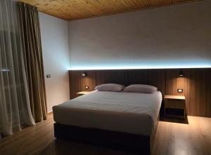 Postel nebo postele na pokoji v ubytování Hotel Aleks