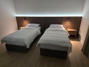 Postel nebo postele na pokoji v ubytování Hotel Aleks