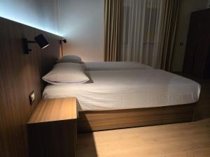 Postel nebo postele na pokoji v ubytování Hotel Aleks