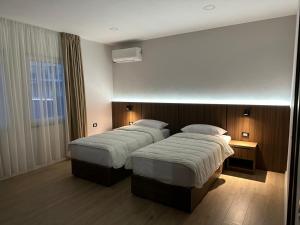 Postel nebo postele na pokoji v ubytování Hotel Aleks