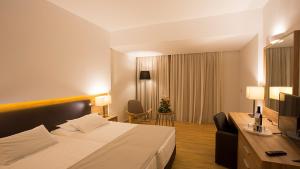Letto o letti in una camera di Calypso Palace