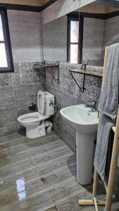 a bathroom with a toilet and a sink at La kasbah bleue in Marrakech