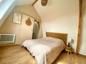 Llit o llits en una habitació de Appartements du 101