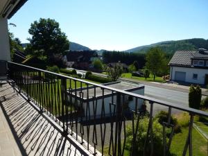 a balcony of a house with a view of a street at Miss Comfortable Holiday Residence in Bad Berleburg