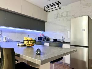 Kuchyň nebo kuchyňský kout v ubytování Modern apartment near McKenzie beach + 20 fotografií