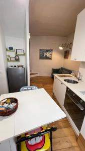a kitchen with a white counter and a sink at Bella Vista Città Vecchia in Polignano a Mare