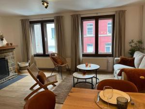 a living room with a couch and a table at Cielle sous Roche in La-Roche-en-Ardenne